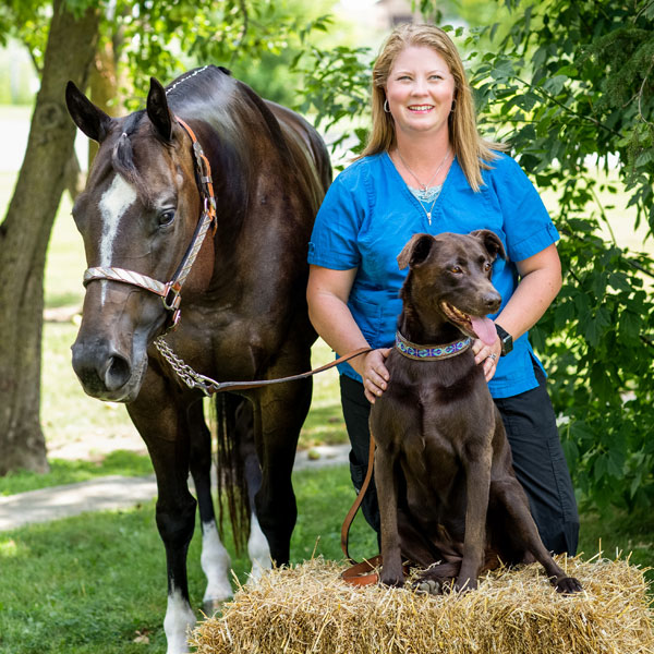 Lindsey with her dog and horse