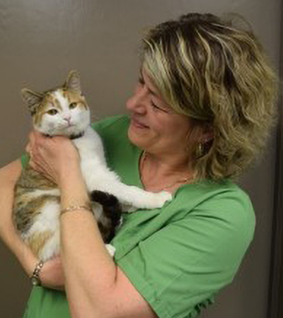 Dr Isabel holding young Stella (clinic cat)